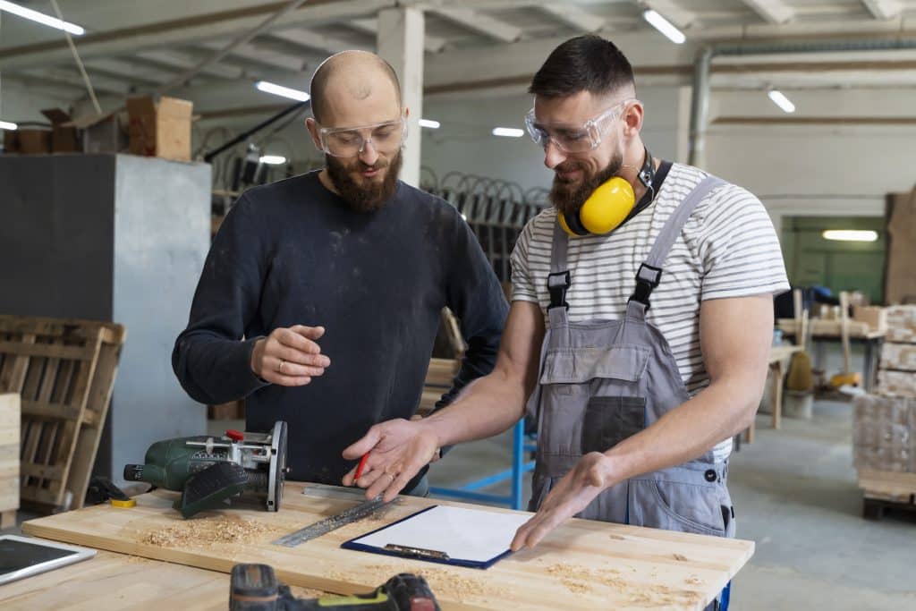 men working cutting mdf board